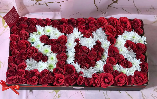 200 red roses flower box with custom white chrysanthemum lettering for romantic gifting in Islamabad
