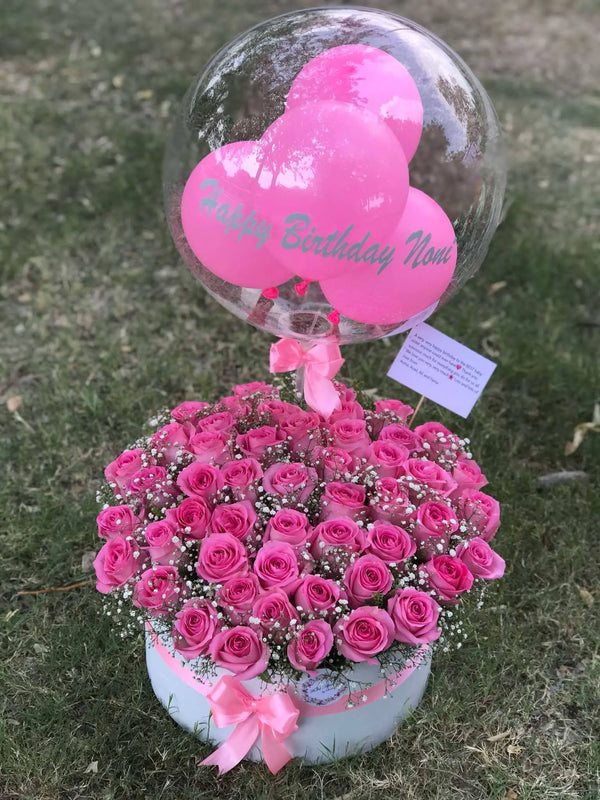 50 imported pink roses in a luxury flower box with custom balloon for delivery in Islamabad