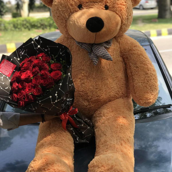 Six-foot teddy bear paired with a fresh red rose bouquet for a grand romantic gift