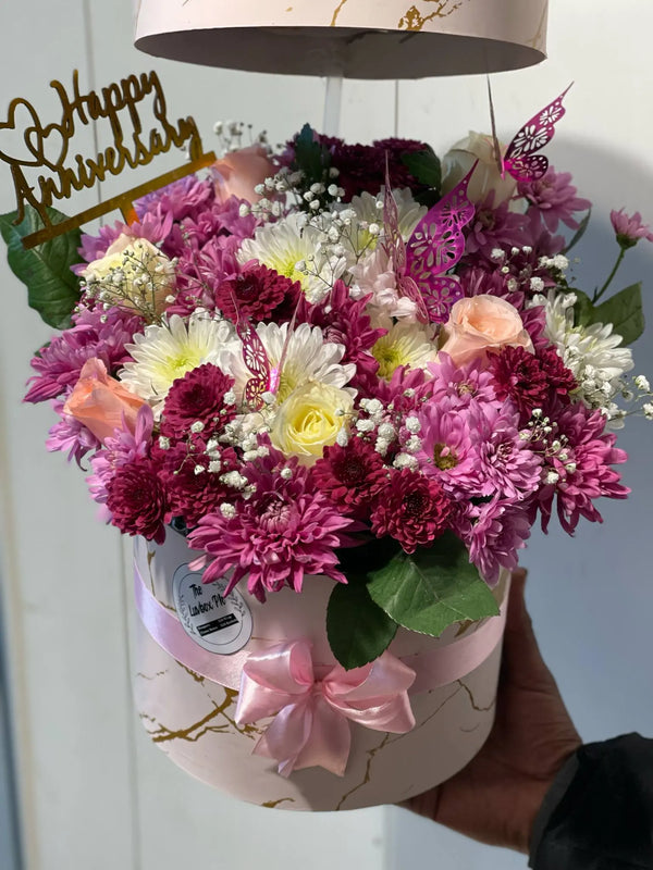 Aesthetic floral gift box for her featuring fresh roses, chrysanthemums and seasonal flowers