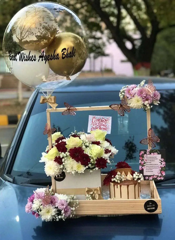 Luxury wooden gift crate with flower box, customized cake and message balloon for delivery in Islamabad