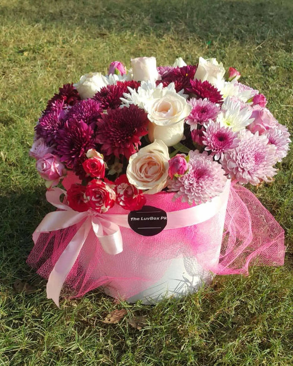 Mixed fresh flower box with roses and chrysanthemums for her in Islamabad Pakistan