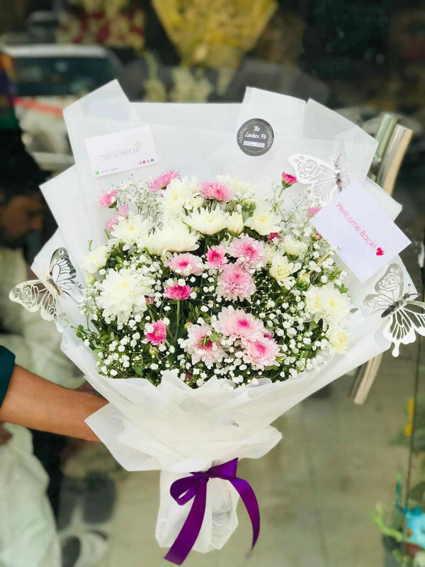 Pink and white chrysanthemum bouquet for flower delivery in Islamabad