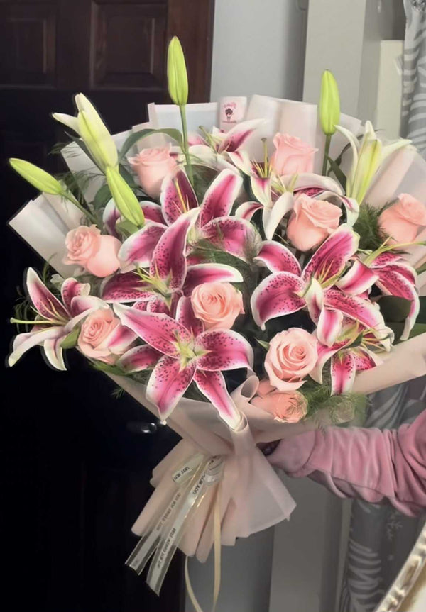 Premium pink lily bouquet with baby’s breath and luxury wrapping