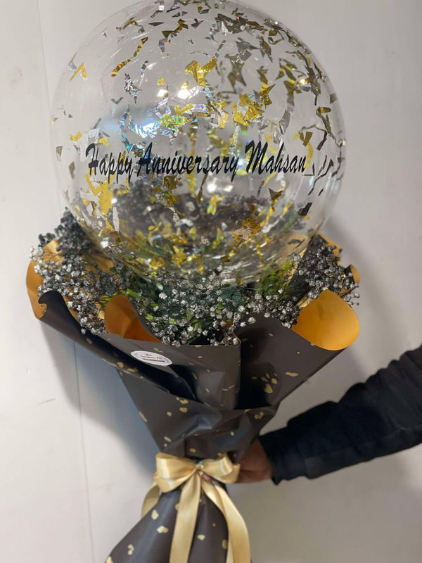 Personalized balloon bouquet wrapped like a floral arrangement with a custom message