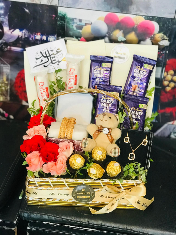 Luxury Eid gift basket with fresh flowers, chocolates and elegant jewelry