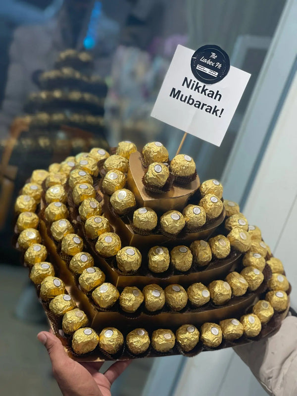 Golden Ferrero Rocher chocolate tower with Eid Mubarak ribbon in Islamabad