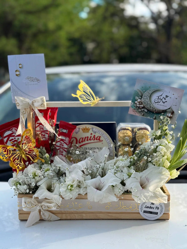 Eid floral snack gift tray with fresh flowers treats and wooden tray in Islamabad