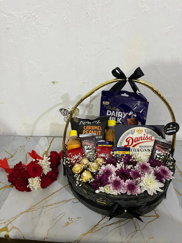 Eid gift basket with fresh jasmine gajray imported chocolates and savory snacks in Islamabad