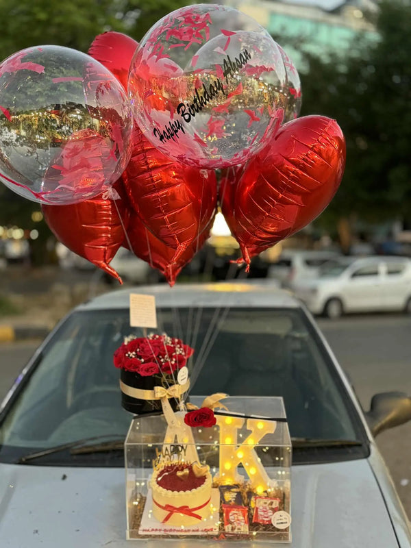 Luxury anniversary gift box with cake flowers balloons LED letter and chocolates in Islamabad