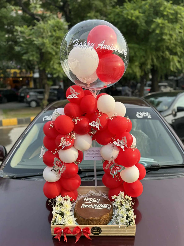 Forever Us anniversary wooden tray with balloon arch, customized cake and fresh flowers