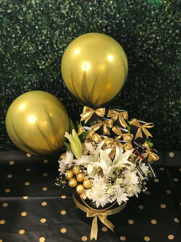 Luxury golden gift box with white roses and imported chocolates in Islamabad