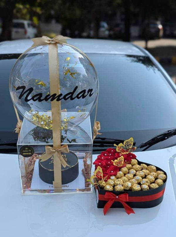 Heart-shaped red rose box with Ferrero Rocher chocolates and customized cake in an LED acrylic box