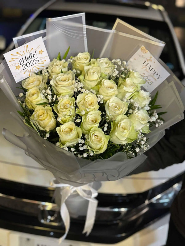 Elegant imported white rose bouquet with premium wrapping for flower delivery in Islamabad