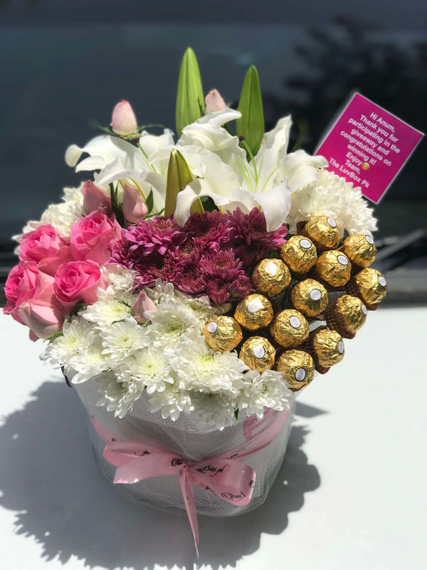 Luxury flower and Ferrero Rocher gift box with roses lilies and chrysanthemums in Islamabad