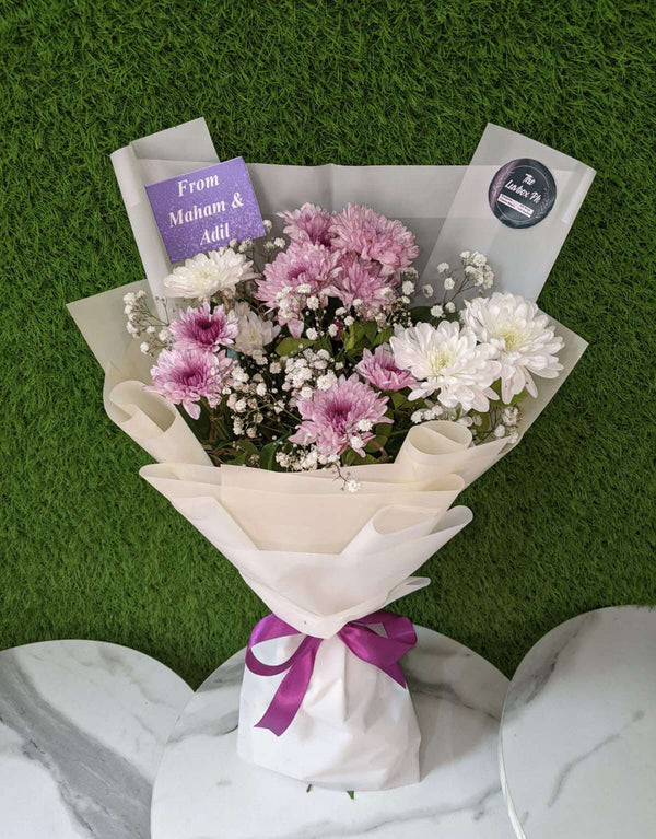 Alt Text:
Petite mini flower bouquet made with fresh seasonal blooms and elegant decorative wrapping