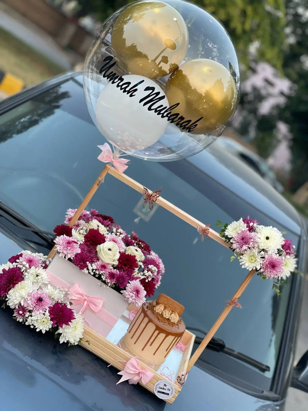 Nikkah Mubarak gift box with Lotus Biscoff cake and fresh flowers in Islamabad