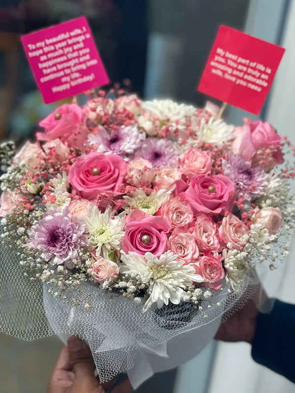 Pink-themed floral gift box featuring pink roses, chrysanthemums and seasonal flowers for her