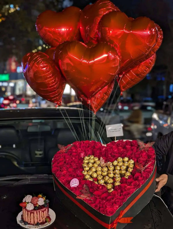 XXL heart-shaped red rose box with Ferrero chocolates, customized cake and balloons in Islamabad